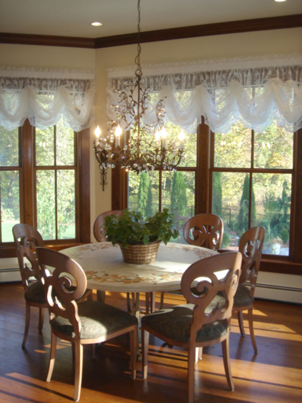 Country kitchen table with luxury chandelier